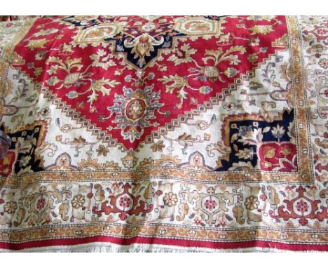 Modern silk carpet decorated with floral medallions upon a red ground, 280 x 200 cm 