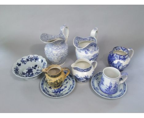 A collection of 19th century and other blue and white printed wares including a Lausanne pattern jug, 22 cm tall, a further j