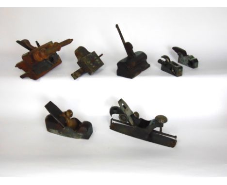 A collection of antique planes and other wood working tools, including a Norris 25 bullnosed shoulder plane, 95cm x30cm