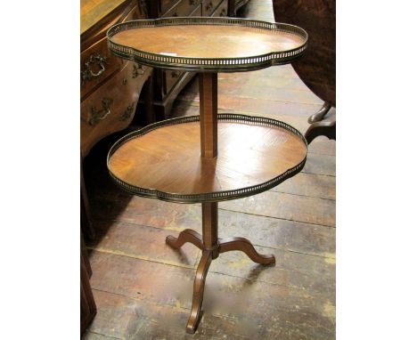 A two tier Kingswood egetaire of graduated form, the two levels raised on an octagonal column and tripod base, maximum width 