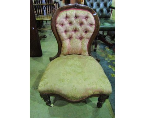 A Victorian walnut drawing room/nursing chair with serpentine upholstered seat and button back within a moulded and simply ca