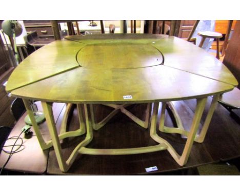 A rare and usual Ercol nest of tables with central square table served by four further shaped leaves upon lyre type supports 