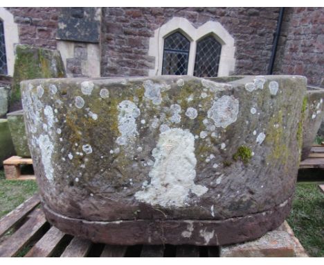 A large natural stone D end shaped trough, tick walled, 110cm long x 88cm wide x 50cm deep approx (2 pieces base broken/detac