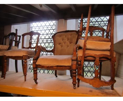 A Victorian spoonback drawing room chair with beige ground upholstered seat and button back within a stained beechwood frame 