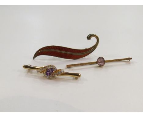A 9ct gold brooch set with amethyst and diamond effect paste stones, a 9ct gold amethyst bar brooch and Norwegian guilloche l