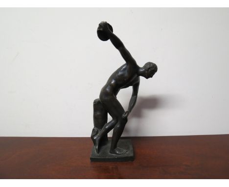 A bronze figure of a discus thrower    