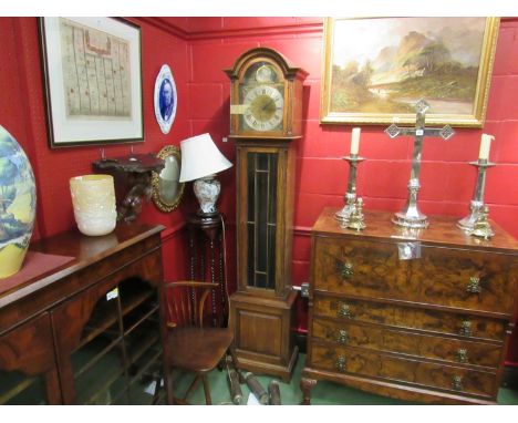 An early 20th Century oak long case clock with glazed panelled door, brass arched dial with silvered Roman chapter ring, thre