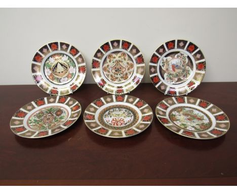 A boxed Royal Crown Derby Limited Edition 1996 Christmas plate 936/2000 and five others dating from 1991 - 1995 (6)