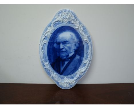 A Middlepart Pottery blue and white ceramic portrait plaque 