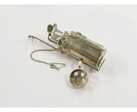 An unusual large silver golf caddy brooch with golf clubs 