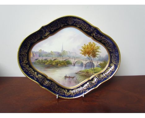 A 19th Century Coalport lozenge form cabinet dish "English Bridge, Shrewsbury", signed R.H. Simpson, 34cm long