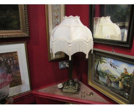 A brass Corinthian column lamp base and shade 