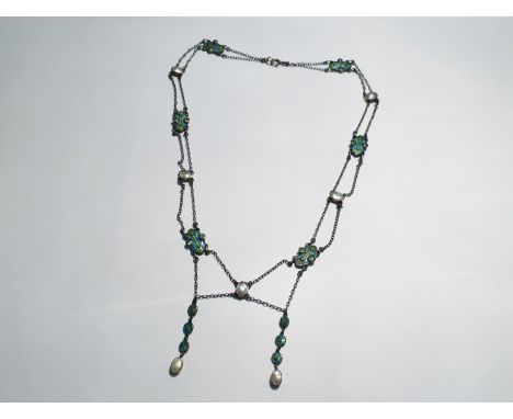 An Archibald Knox style enamel necklace with blues and greens, clasp stamped 9c, cased