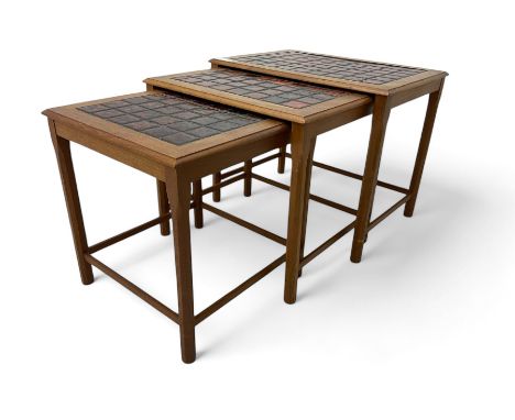 Mid-20th century teak tile top nest of tables, rectangular top with inset tile grid, raised on chamfered rounded supports wit