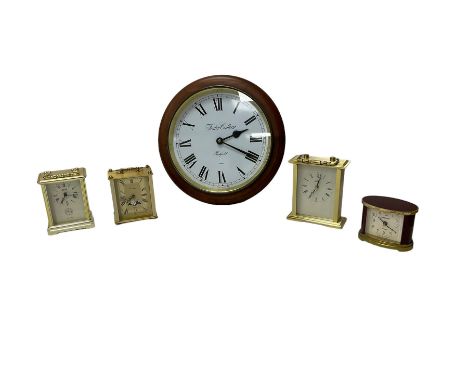 Quartz wall clock and four quartz mantle clocks.