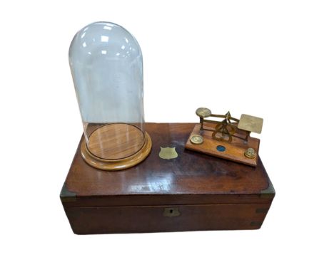 Early 20th century brass bound wooden writing slope, together with a glass dome with wooden base and a small set of brass sca