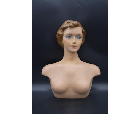 A 1940's moulded laminated lady's dress shop mannequin. H.54 W.40cm 