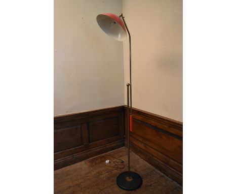 A mid century vintage brass standard reading lamp with hinged cantilever action and metal domed shade and circular base. H.19