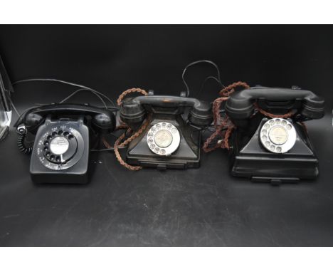A vintage rotary dial bakelite telephone, another similar and a 1960's example. H.26 W.23 D.15cm 