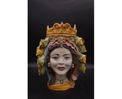 A Sicilian Teste di Moro majolica hand painted ceramic vase in the form of a ladies head with lemons and foliage. Signed to b