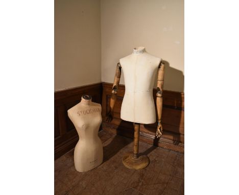 A vintage Stockman female mannequin and a vintage style Kent and Curwen male mannequin on stand with articulated arms. H.125 