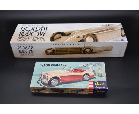 A boxed Schylling Golden Arrow racing car along with a Revell Austin Healey model kit. H.10 W.54 D.17cm (Golden Arrow) 