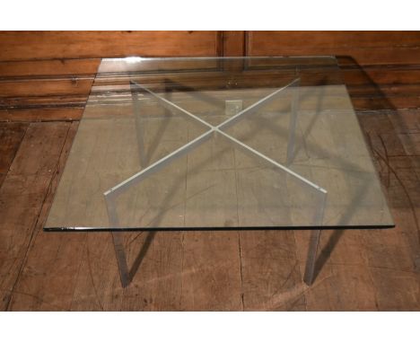 A Knoll Studio Barcelona coffee table designed by Mies van der Rohe with plate glass top on chrome base and maker's label to 