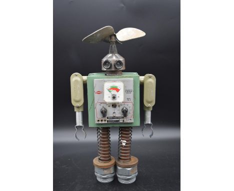 A metal robot sculpture made from vintage electrical components. H.49 W.26cm 