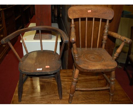 A Victorian stained beech childs commode chair, having spindle back above a saddle seat, on turned supports united by stretch