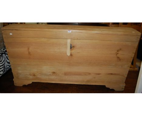 A large late 19th century Scandinavian pine dome-top trunk, flanked by cast iron handles, w.142cm