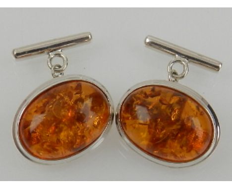 A pair of white metal and synthetic amber cufflinks, stamped 925.
