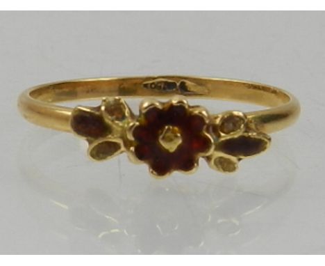 A yellow metal floral ring, enamelled in red and yellow, the shank stamped 750. 
