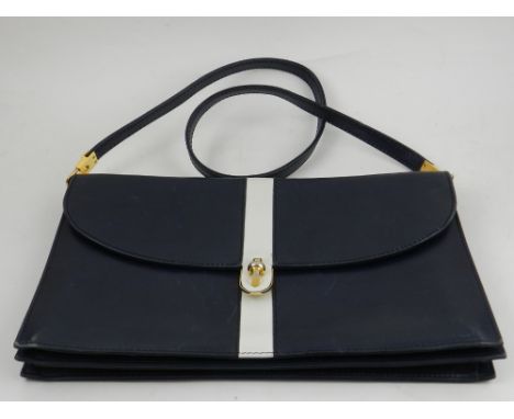 Asprey, London. A ladies navy and white leather handbag.