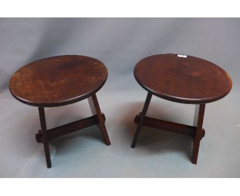 A pair of Heals mahogany stools with button label. 