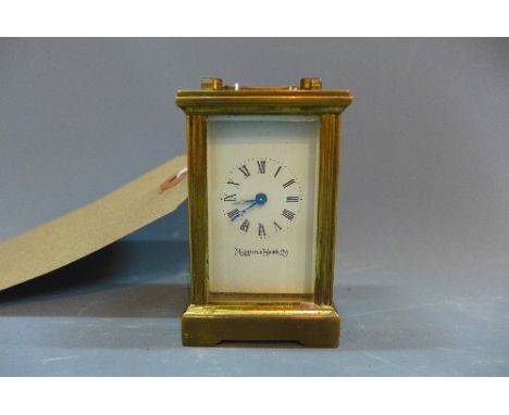 A 20th Century Mappin and Webb miniature carriage clock with bevelled glass panels. 