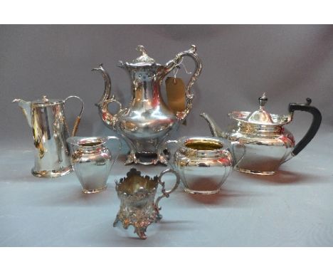 A Victorian James Dixon and Sons silver plated teapot having scrolling handle and spout, stem finial and outowpt floral base,