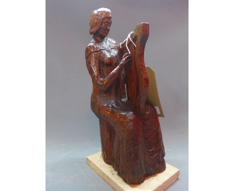 An early 20th Century carved pitch pine statue of a lady playing a harp, raised on marble base. Signed G.Woodhead. H-37cm 