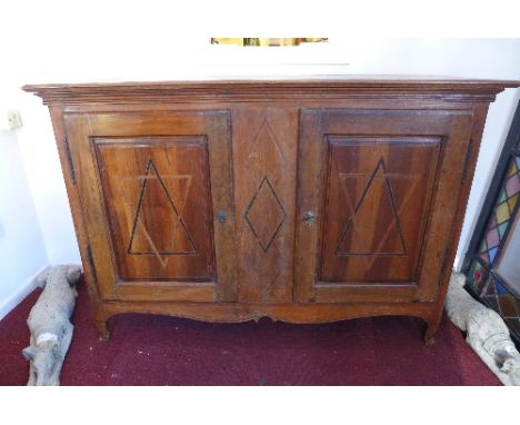 A 19th Century Italian walnut side cabinet with ebony and boxwood inlay having two doors enclosing two drawers and shelf spac