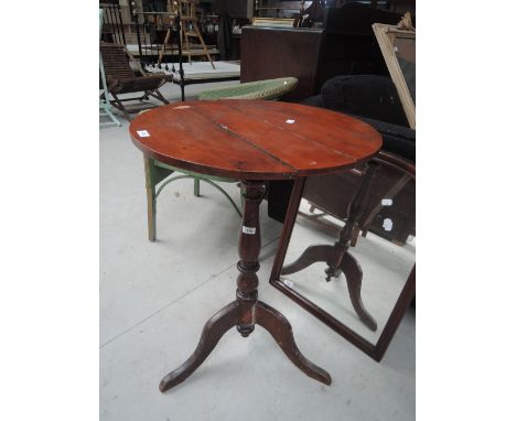 A 19th century stained frame pedestal table having circular top on tripod legs