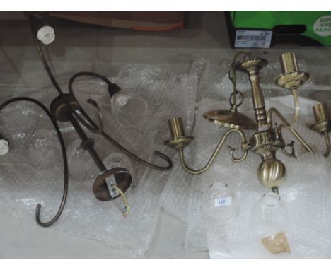 Two brass three stem light fitting with glass shades