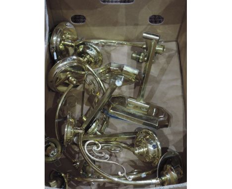A selection of brass wall mounted light fittings. 