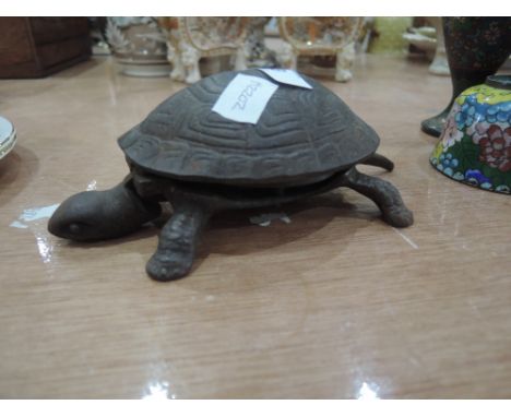 A metal turtle clock work egg time