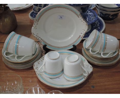 A part tea service in white, blue and gilt