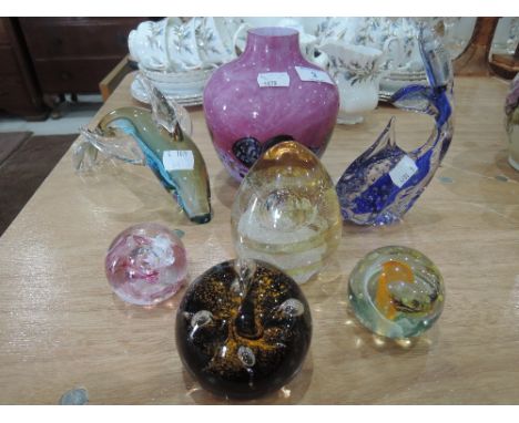 A selection of paperweights and art glass including Caithness Moonflower, glass Dolphin etc