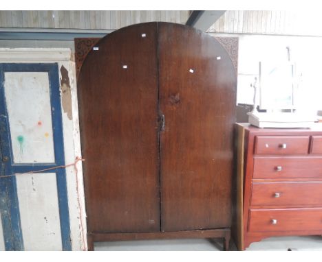 A 1930's oak arch top wardrobe