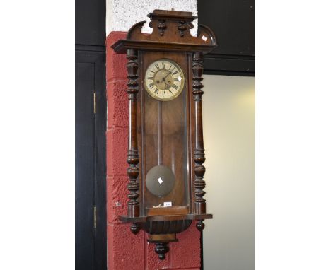 A walnut Vienna wall clock, retailed by Fattorini & Sons Ltd, Westgate, Bradford, enamelled chapter ring, Roman numerals, gla