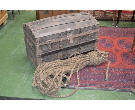 An early 20th century dome topped trunk, c.1900 and in excess of 10m of 3/4 inch rope (2)
