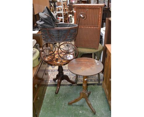 A Lloyd Loom style occasional table and linen basket; two occasional tables; a standard lamp; a dolls pram