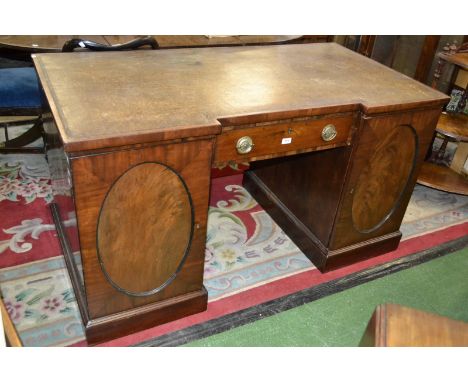 A large Georgian desk, folio cabinet to right pedestal concealing secret drawers