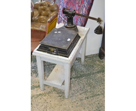 A set of early 20th century cast iron weighing scales.